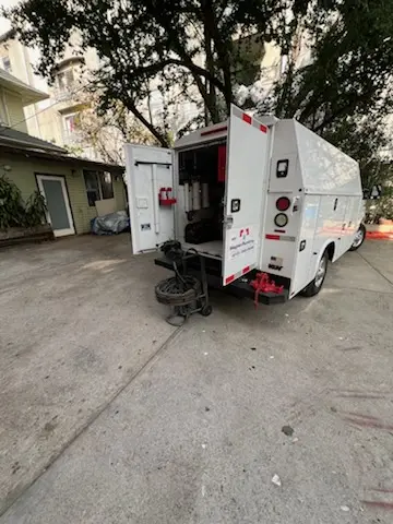 Magnet Plumbing service vehicle on-site for Grease Trap Cleaning in Bay Pines